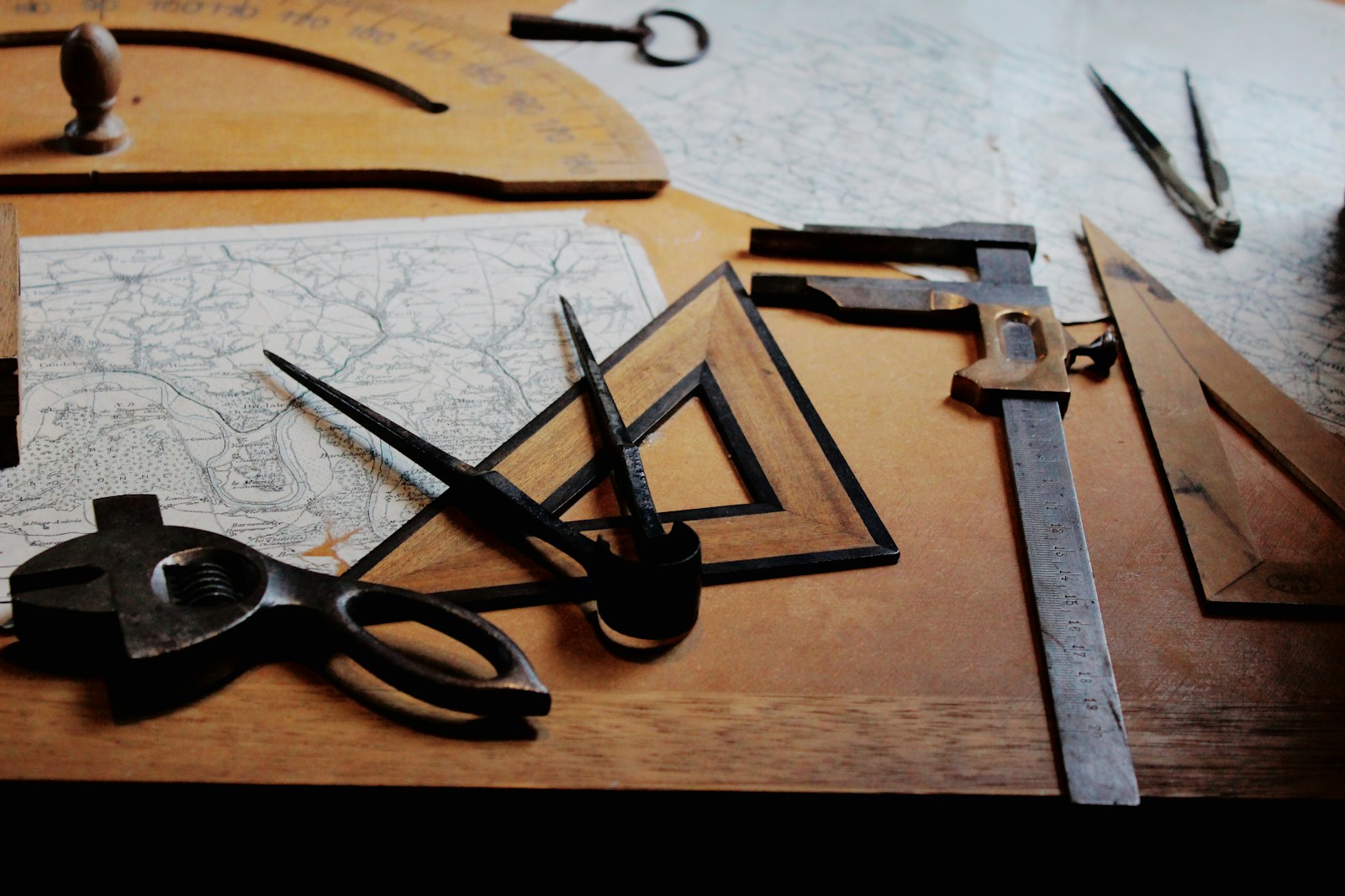 Drafting compass and measuring tools on a work surface